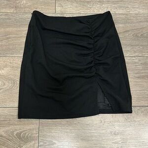 Black bodycon mini skirt with scrunching and slit small